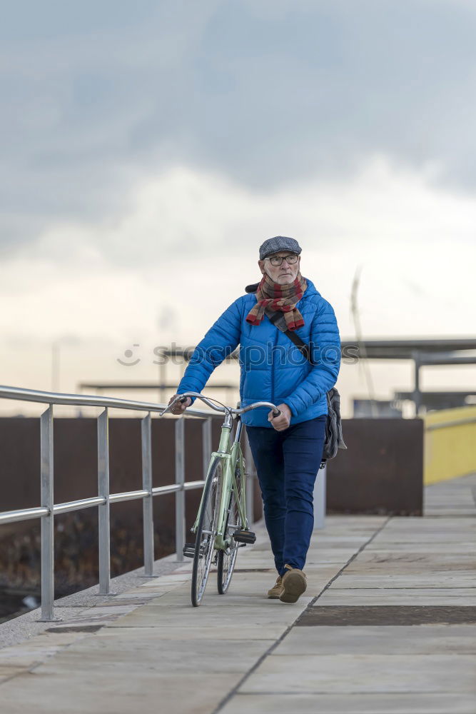 Similar – Image, Stock Photo Portrait senior man walking with his bicycle next to the sea