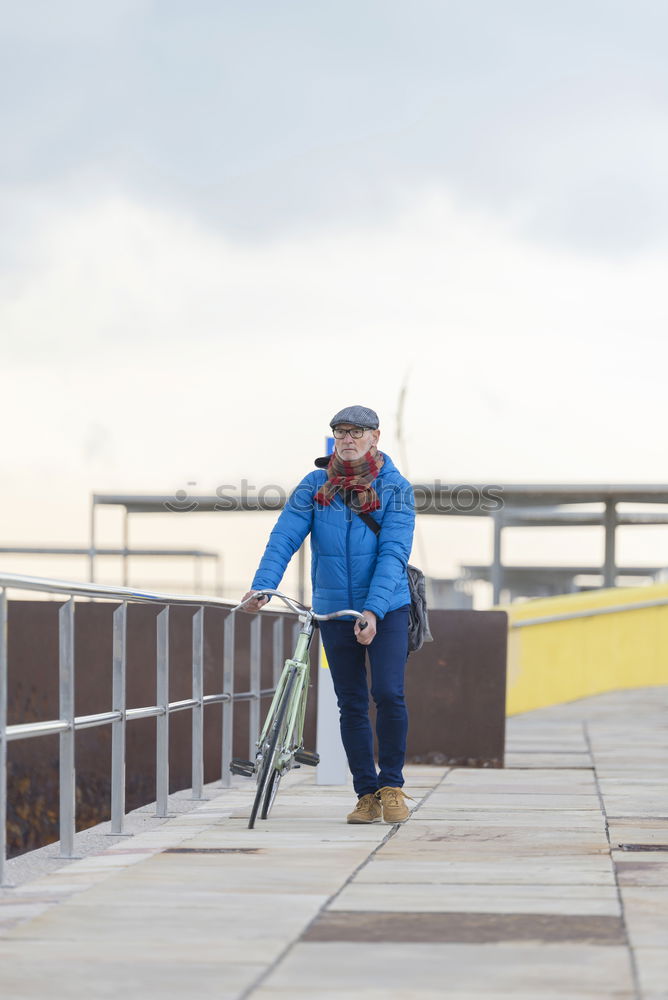 Image, Stock Photo Portrait senior man walking with his bicycle next to the sea