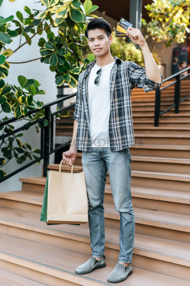 Similar – Portrait of young skateboarder man with bad boy face in the middle of the street.