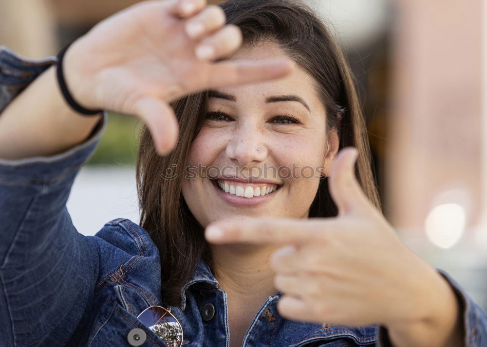 Similar – Close portrait of beautiful young woman with green eyes smiling at camera