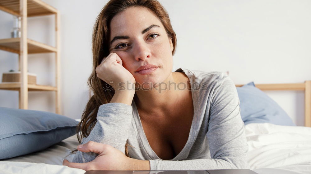 Similar – Young woman lying in bed