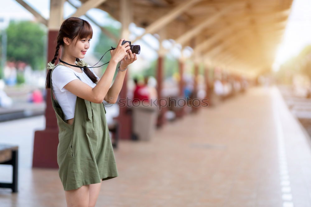 Similar – Close up of a photographer with her camera.