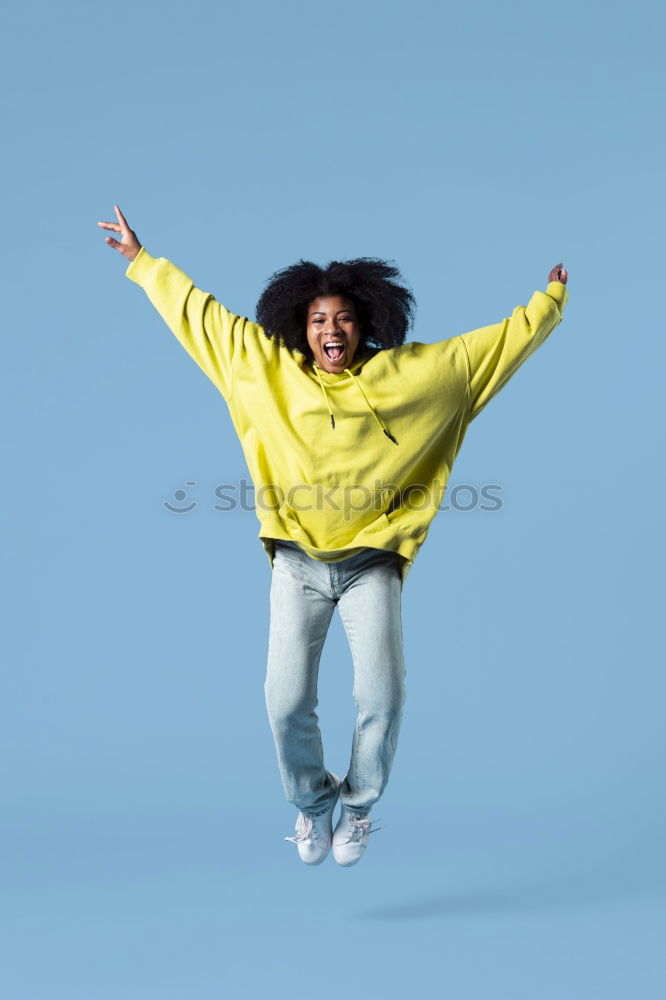 Similar – Woman with afro hair climbing by children’s attractions.