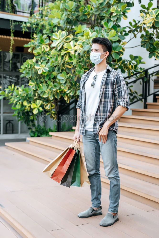 Similar – Portrait of young skateboarder man with bad boy face in the middle of the street.