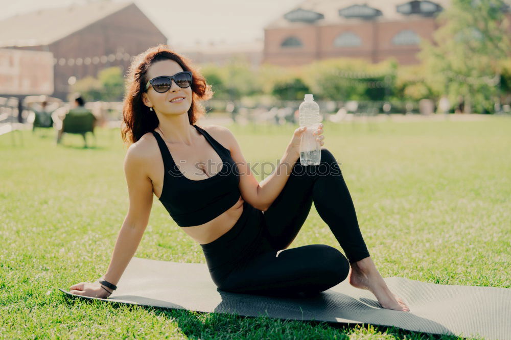 Similar – Image, Stock Photo Happy fit young woman does stretching workout on fitness mat practices yoga outside dressed in activewear has strong body breathes fresh air outdoor leads active lifestyle. Sport fitness concept