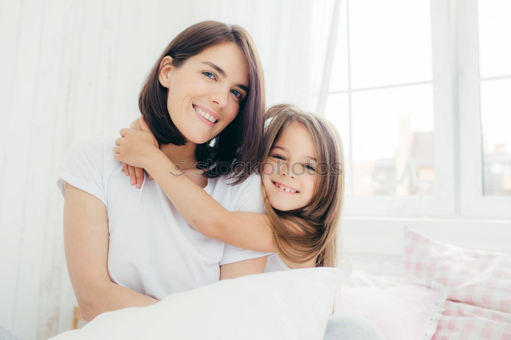 Similar – Image, Stock Photo mother kisses her toddler son in bed for good night