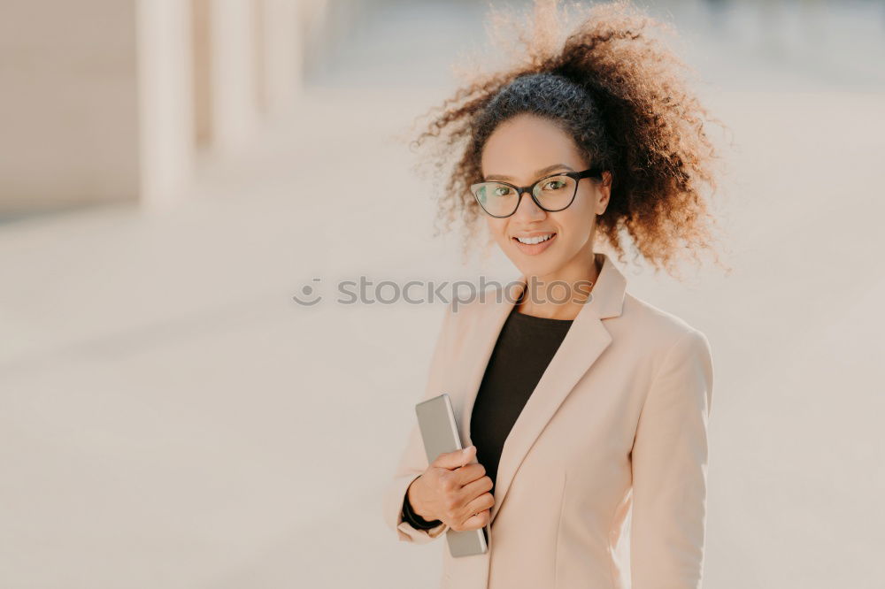 Similar – Stylish woman in jacket talking phone