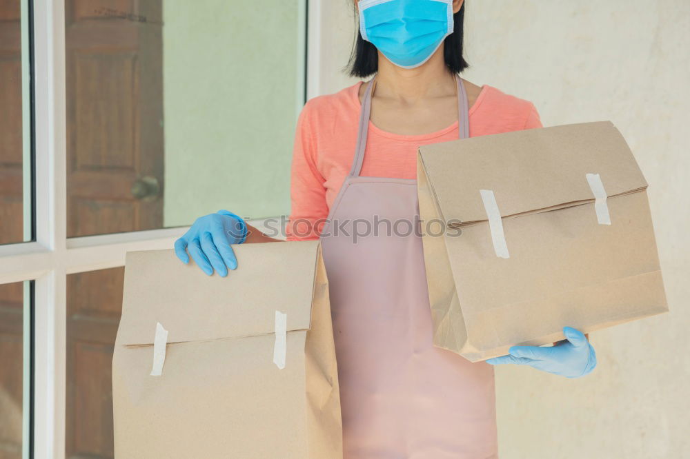 Similar – A househusband in pink slippers and cleaning utensils