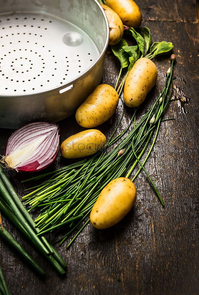 Image, Stock Photo Preparing young potatoes on a wooden table