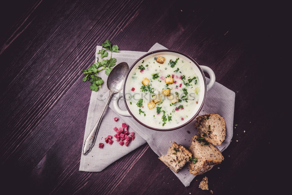 Similar – Pumpkin soup on the plate and salad