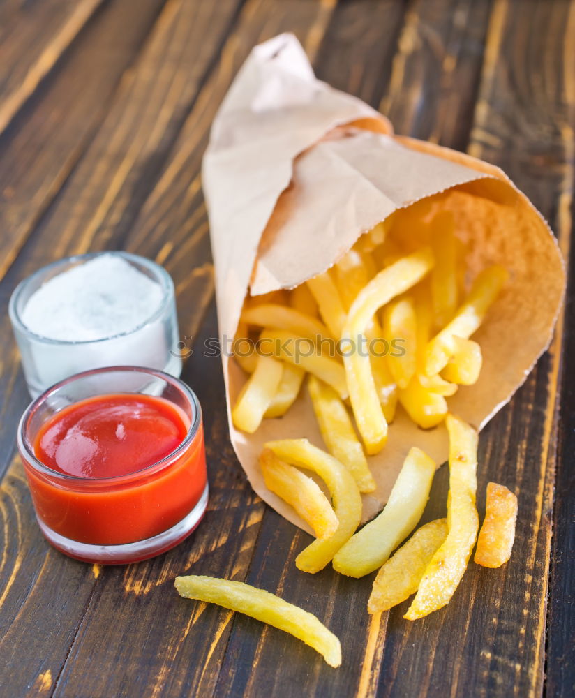 Similar – Salchipapas (Fries with Sausage) South American Fast Food