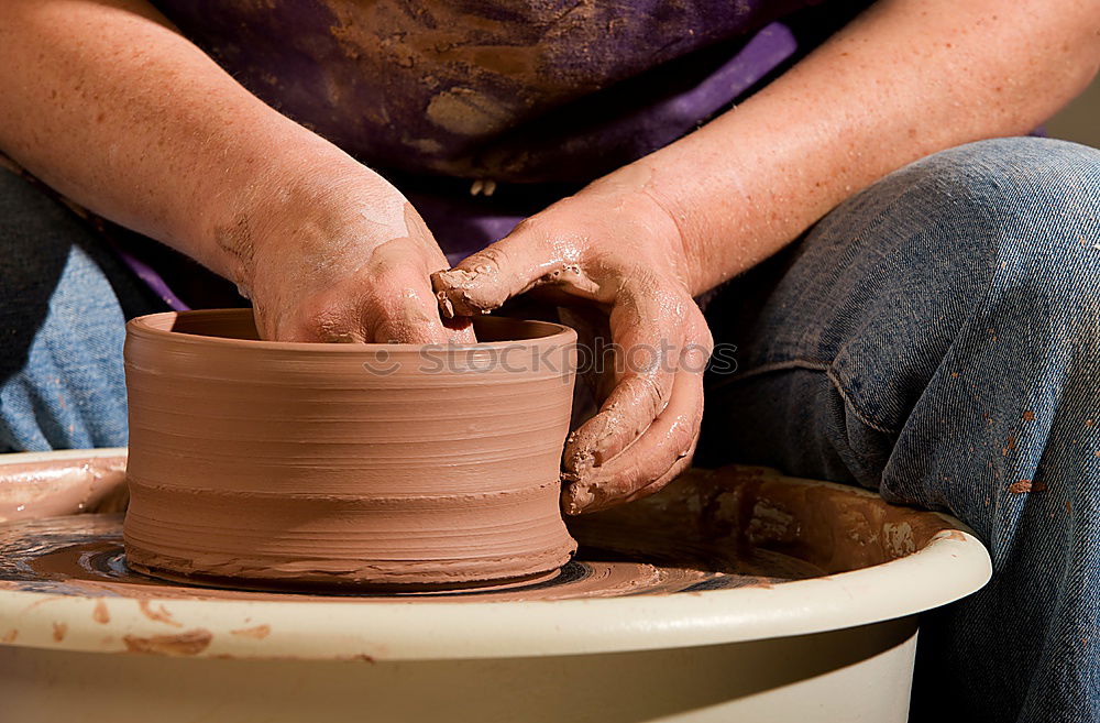 Similar – Female hands forming clay pot