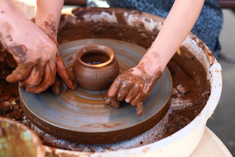 Similar – Potter making the pot in traditional style. Close up.