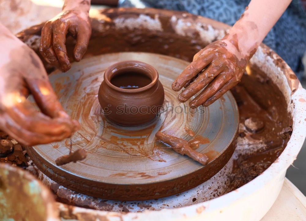 Similar – Potter making the pot in traditional style. Close up.