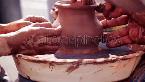 Similar – Potter making the pot in traditional style. Close up.