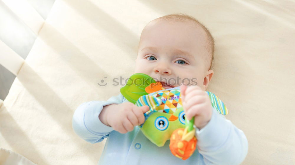 Similar – Image, Stock Photo Baby girl two months old looking at a doll
