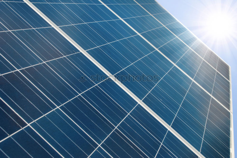 Similar – Photovoltaic panels in a solar power plant over a blue sky.