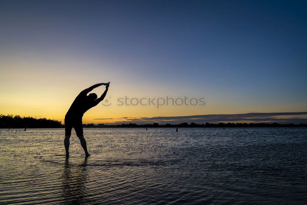 Similar – Athletic man balancing on gymnastic rings