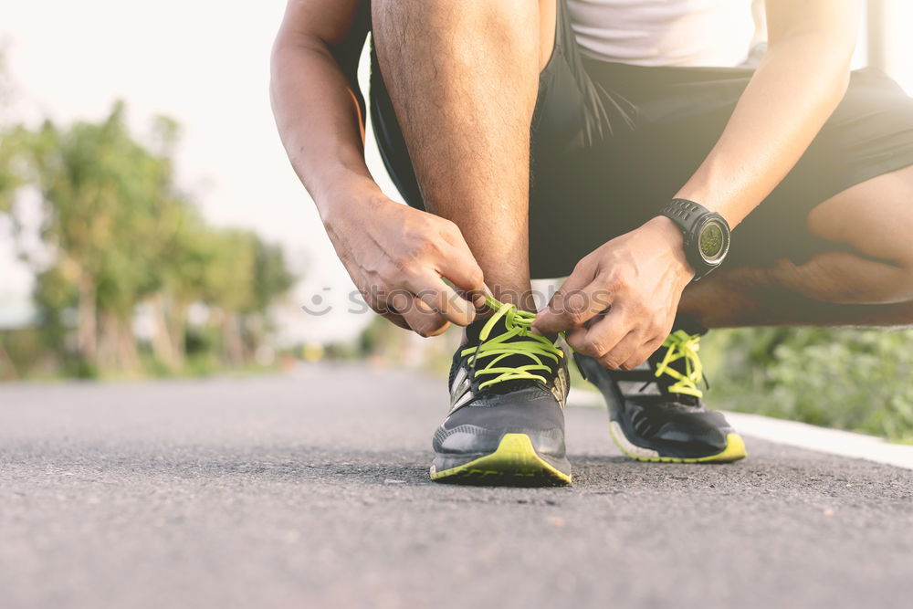 Similar – Sportsman looking a smartwatch