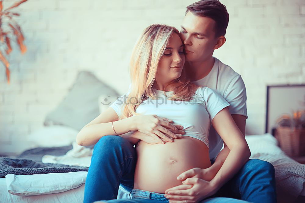 Similar – Image, Stock Photo Happy pregnant couple feeling the movements of their baby