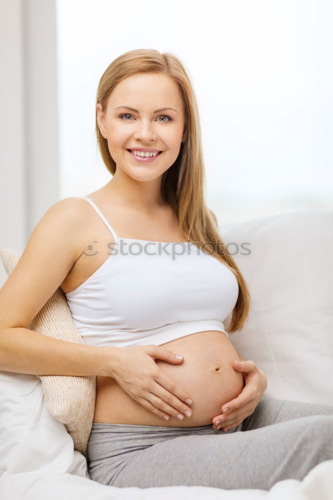 Similar – Pregnant woman touching her belly