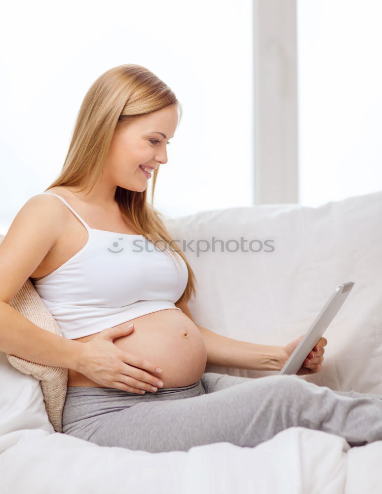 Similar – Pregnant woman touching her belly