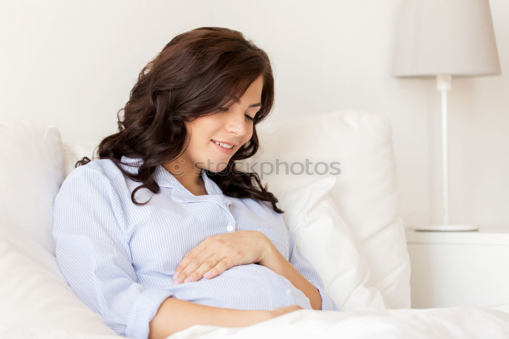 Similar – Pregnant woman touching her belly