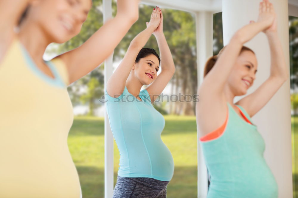 Similar – Group of young sporty attractive women in yoga studio, practicing yoga lesson with instructor, standing, stretching and relaxing after workout . Healthy active lifestyle, working out indoors in gym