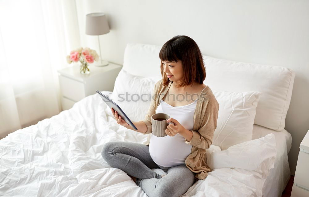 Similar – woman with laptop on her sofa at home