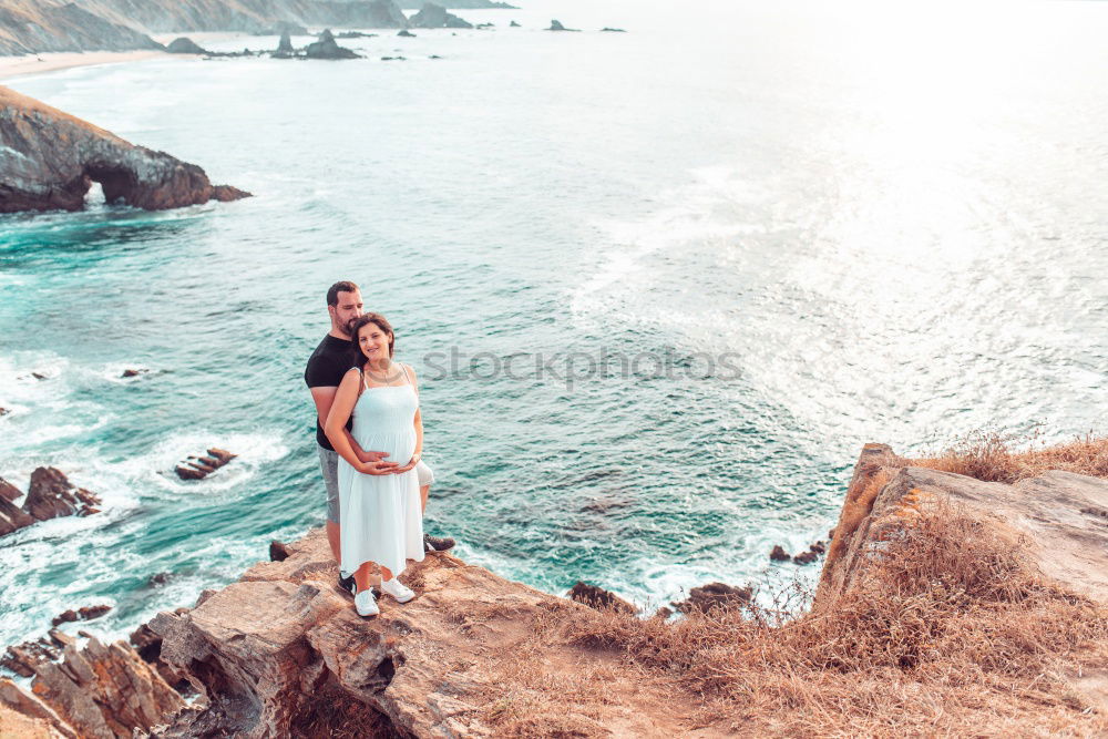 Similar – Image, Stock Photo Men standing on cliff at ocean