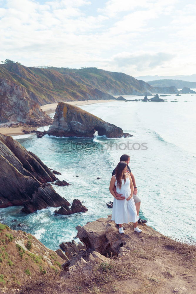 Similar – Image, Stock Photo Men standing on cliff at ocean