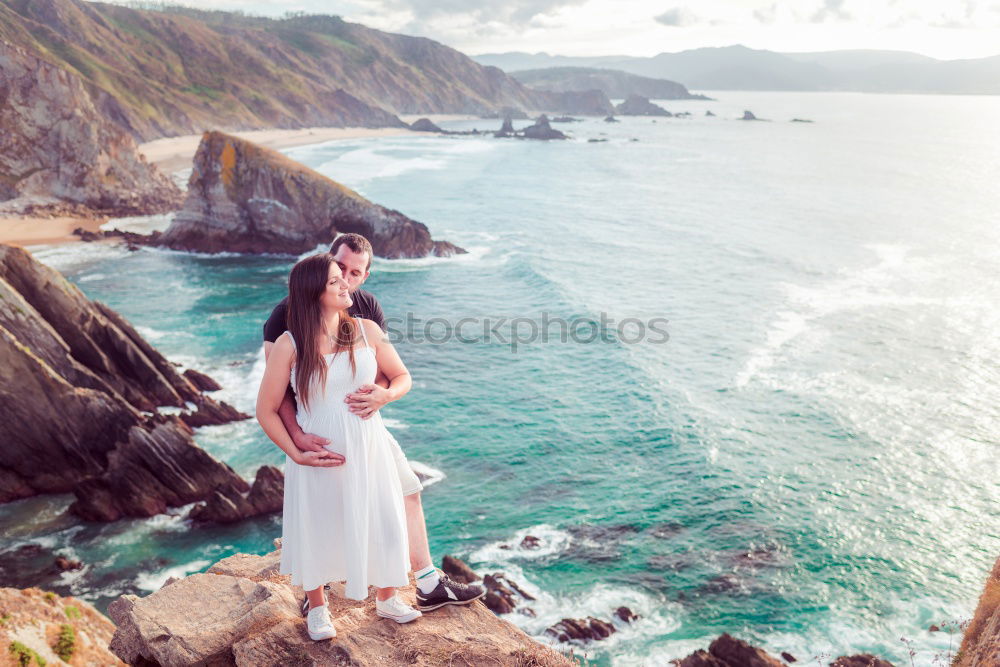 Similar – Image, Stock Photo Men standing on cliff at ocean