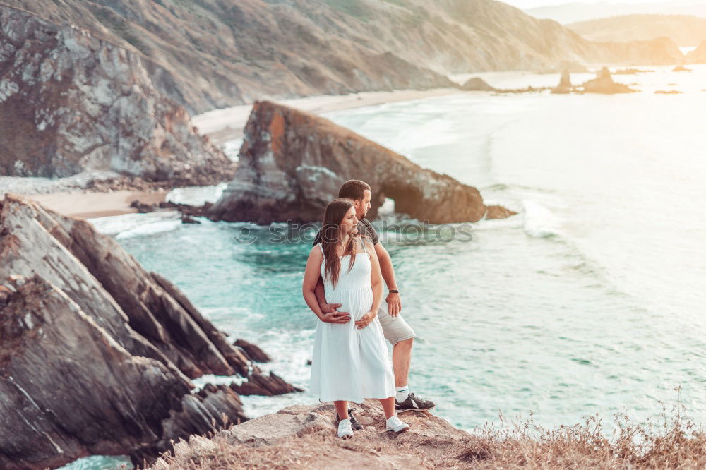 Similar – Image, Stock Photo Men standing on cliff at ocean