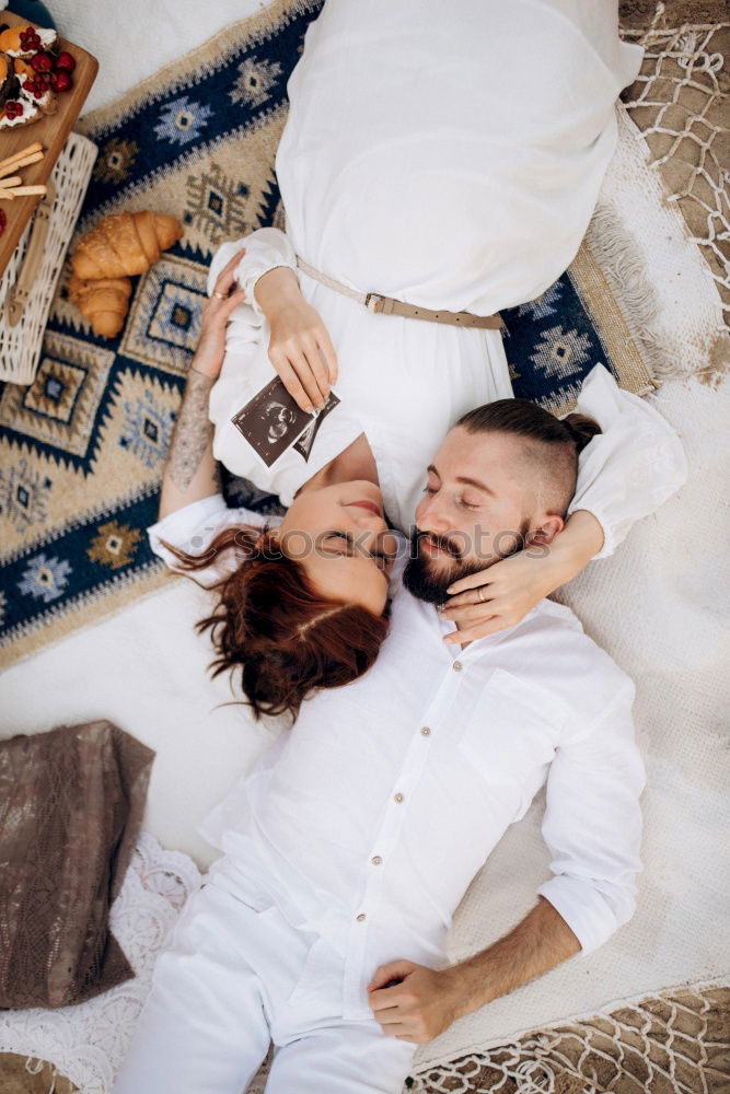 Similar – Happy couple embracing on bed