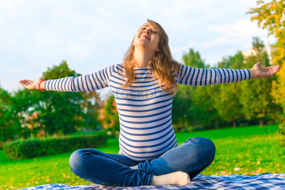 Similar – Women wearing t-shirt and jeans stays outdoor in the park