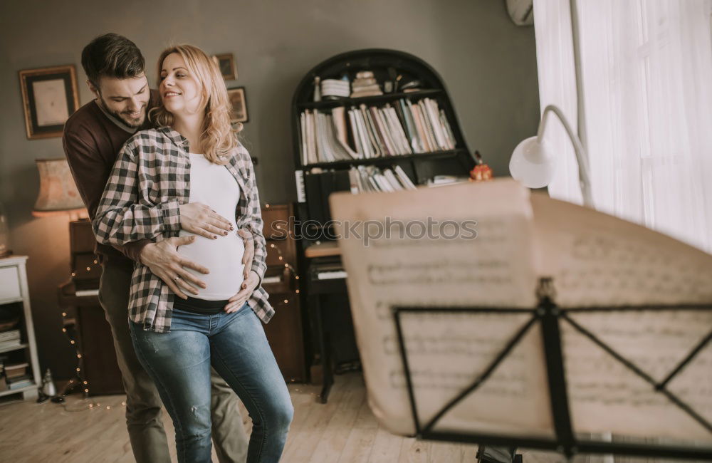Similar – Image, Stock Photo Son is showing his mother a picture on laptop