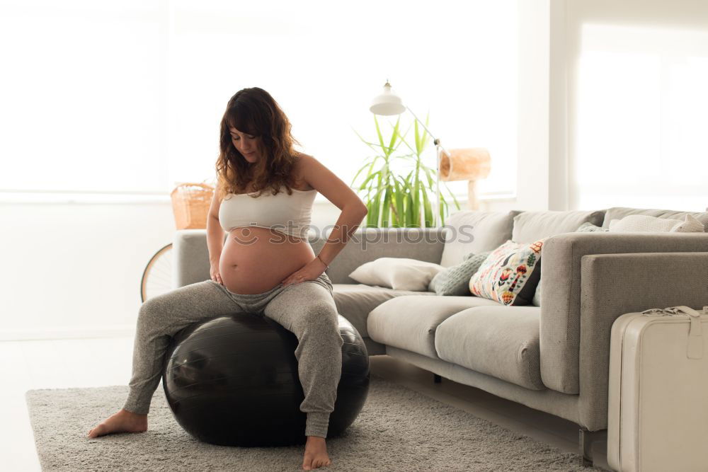 Similar – Pregnant woman touching her belly