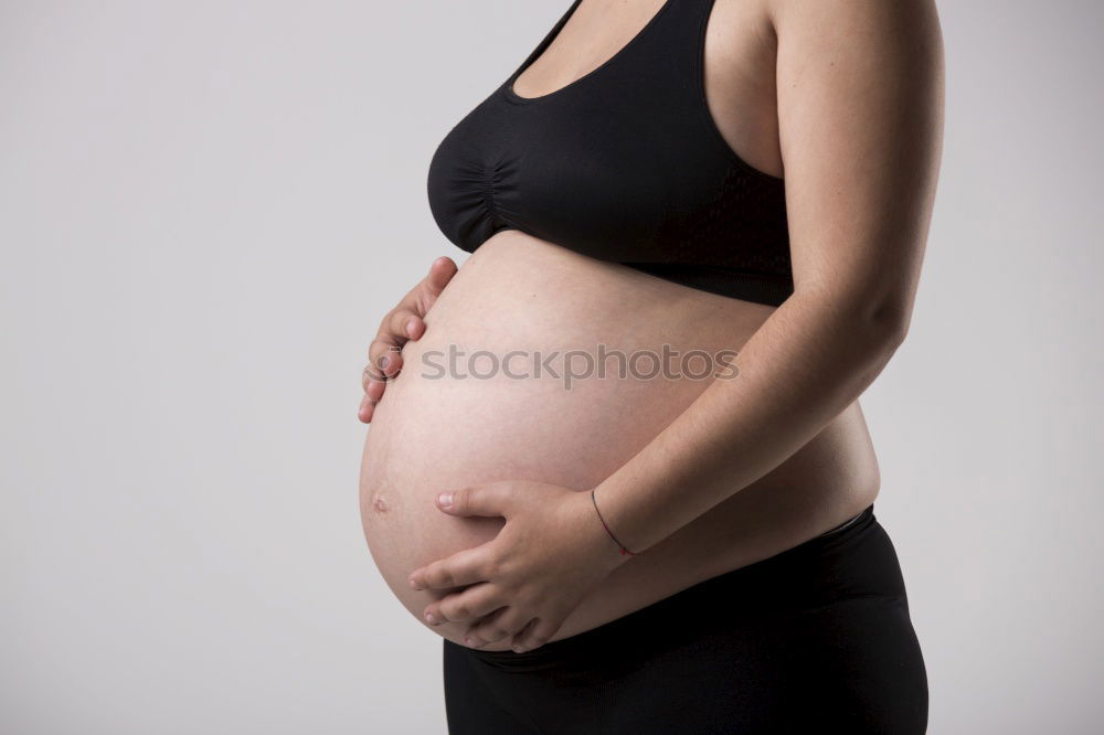 Similar – Who am I? Young woman holding a round mirror in front of her body. The mirror is showing her blurred face.