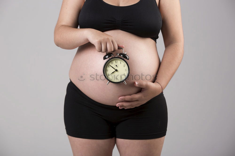 Similar – Who am I? Young woman holding a round mirror in front of her body. The mirror is showing her blurred face.