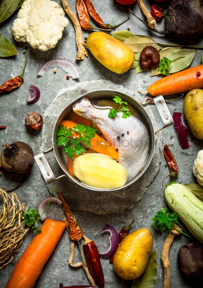 Similar – Image, Stock Photo Vegetables and herbs for cooking around empty chopping board