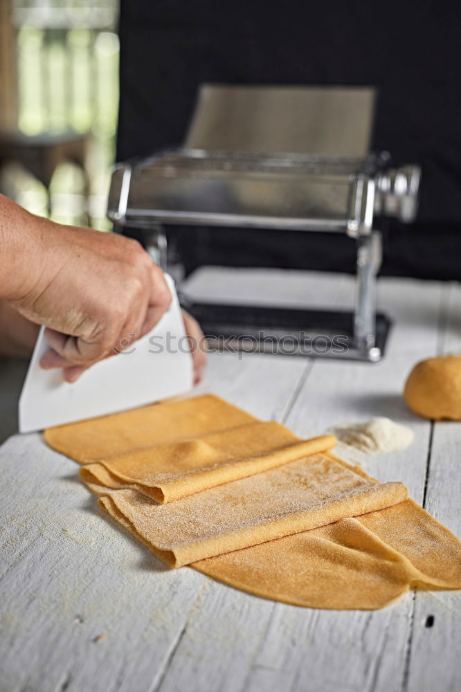 Similar – close up view of woman hand cutting nuts with knife