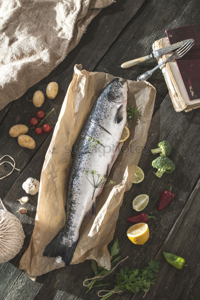 Similar – Image, Stock Photo Preparing whole salmon fish for cooking.