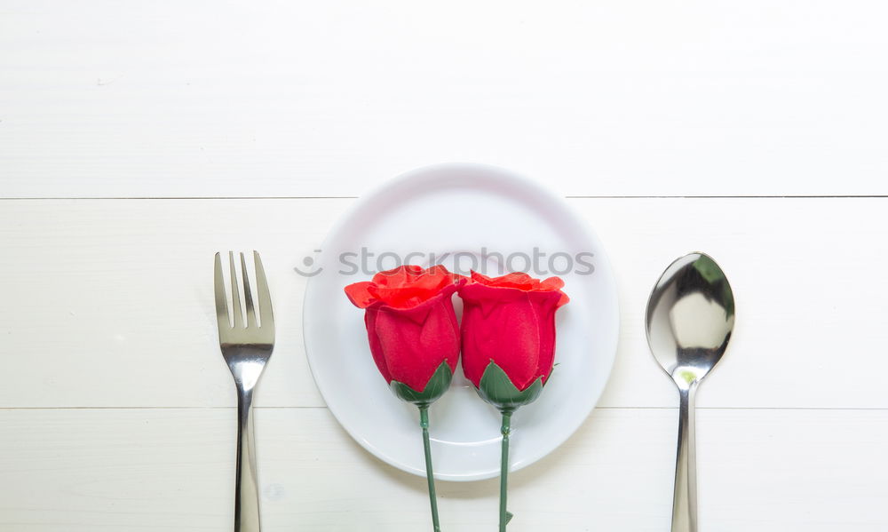 Similar – White plate with vintage iron cutlery