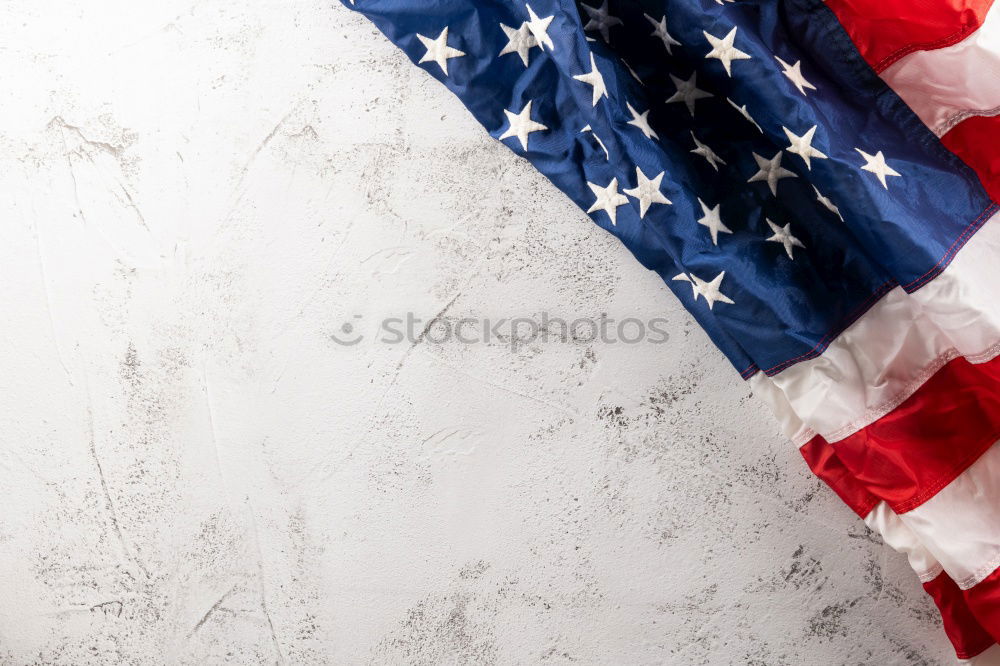 Similar – Man holds American flag in hand