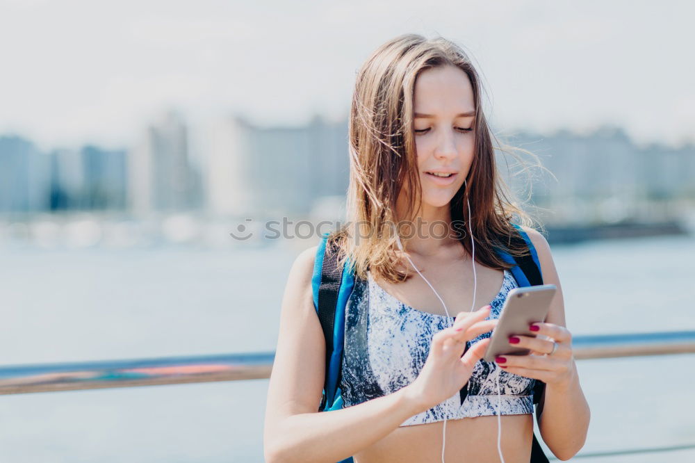 Similar – Image, Stock Photo Young woman with mobile phone walking a city street