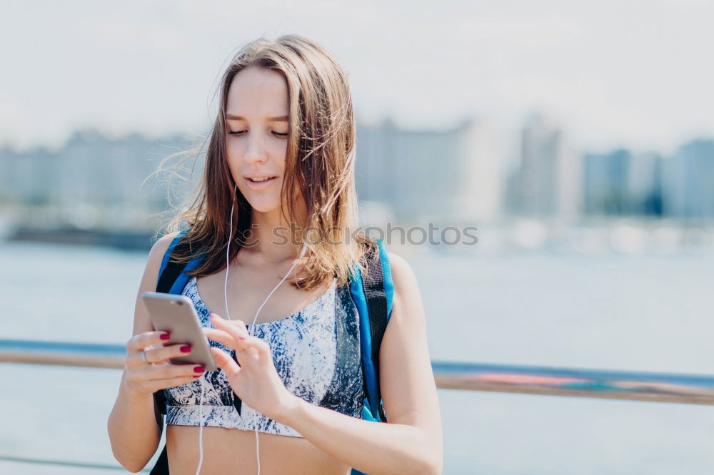 Similar – Image, Stock Photo Young woman with mobile phone walking a city street