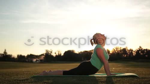 Similar – Image, Stock Photo woman doing yoga and pilates outdoor with her mat