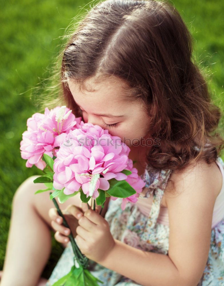 Similar – little girl observing flowers