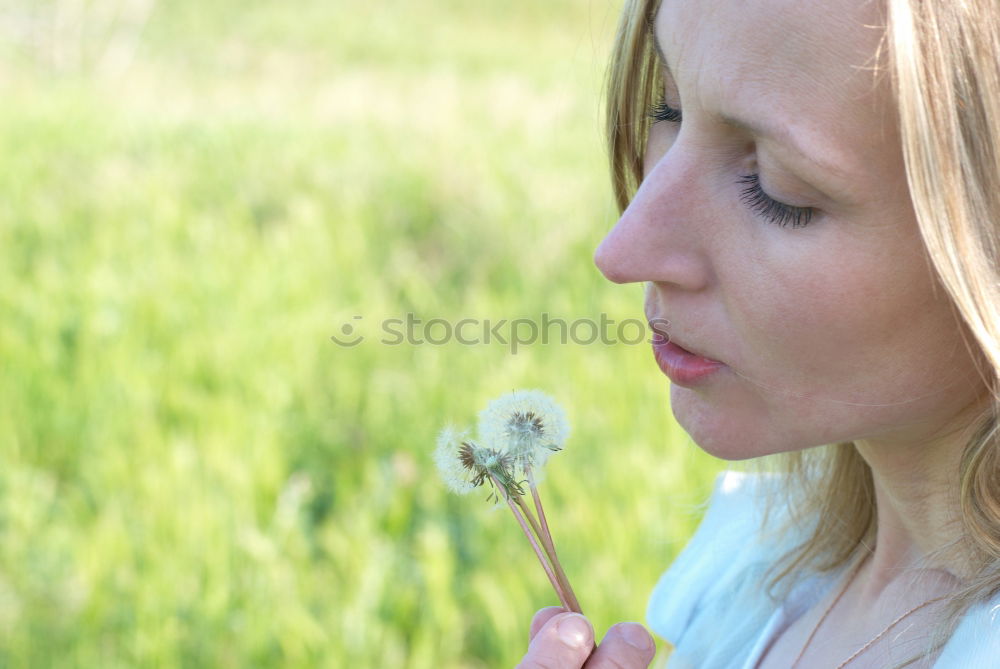 Similar – aerial Hand Dandelion Blow