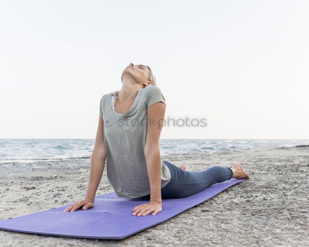 Similar – Image, Stock Photo Caucasian blonde woman practicing yoga in the beach